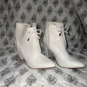 size- roughly 8 1/2
white heels